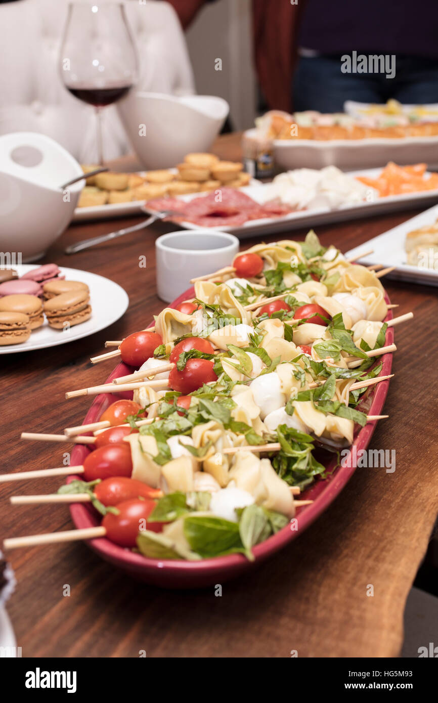 Main appetizer skewered tomatoes, mozzarella cheese, quiche, cold cuts