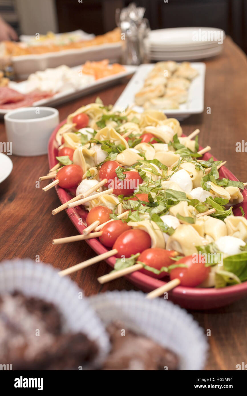 Main appetizer skewered tomatoes, mozzarella cheese, quiche, cold cuts