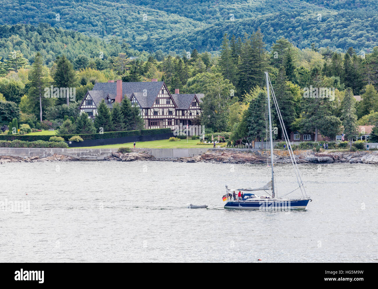 Large tudor mansion among evergreens on the coast of Maine near Bar