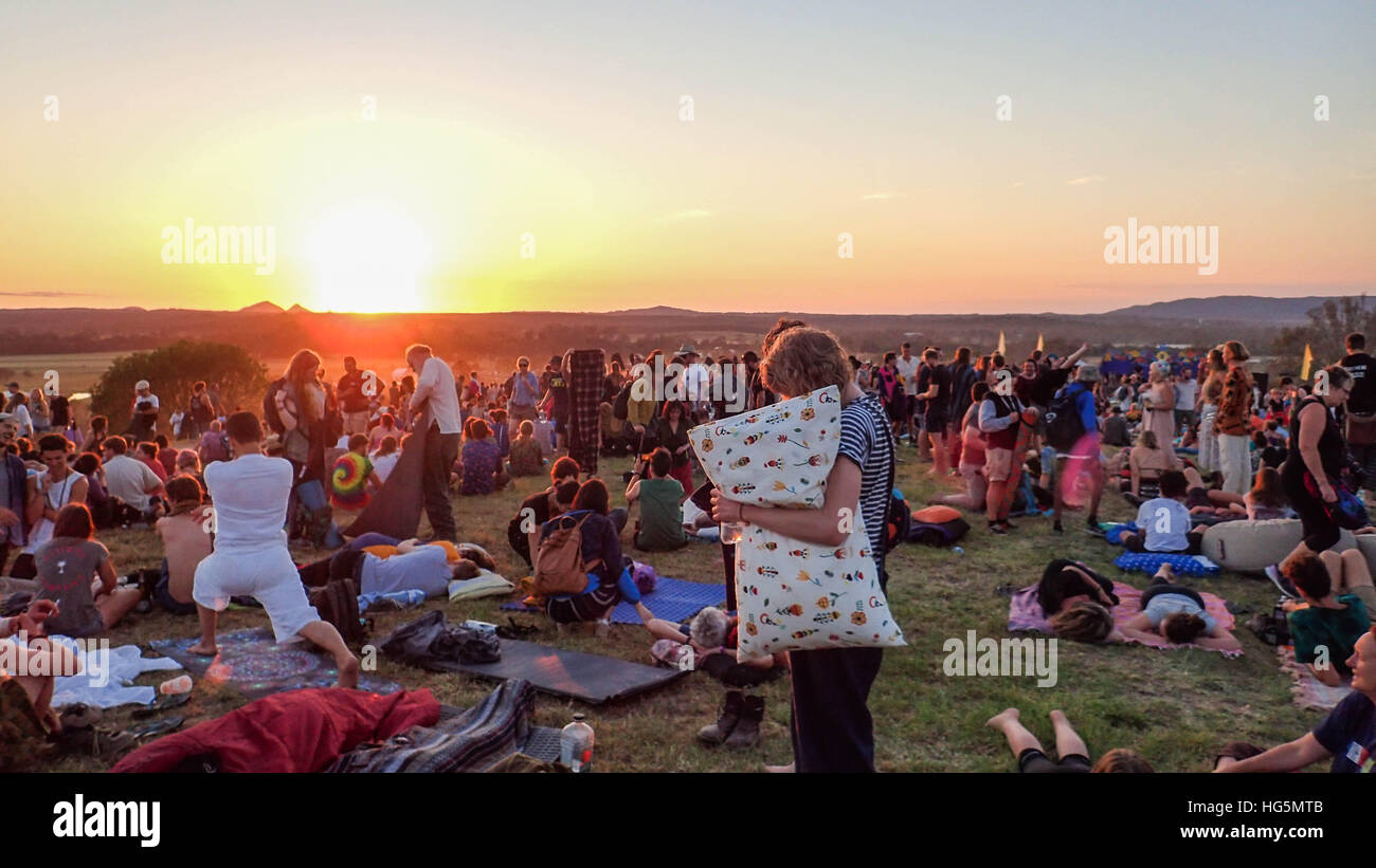 People gathered on a hilltop to watch the sunrise. Stock Photo