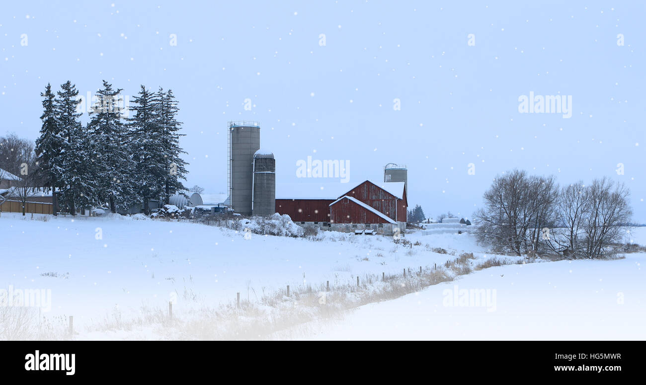 A Red barn and falling snow Stock Photo - Alamy