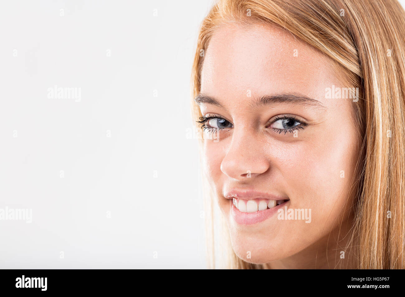 close up portrait of a blonde beautiful girl with blue eyes Stock Photo ...