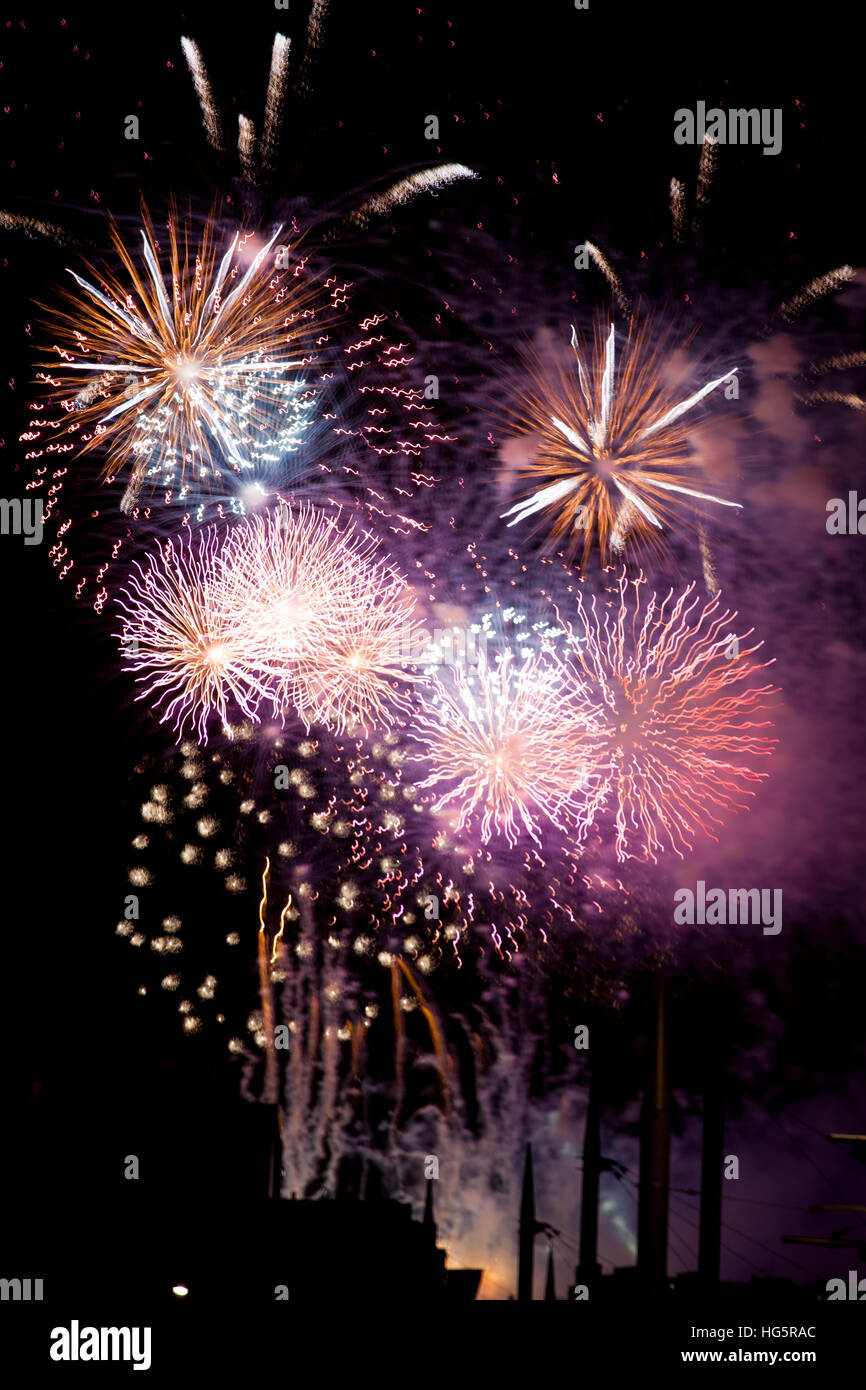Fireworks exploding over Edinburgh castle at New Year Stock Photo