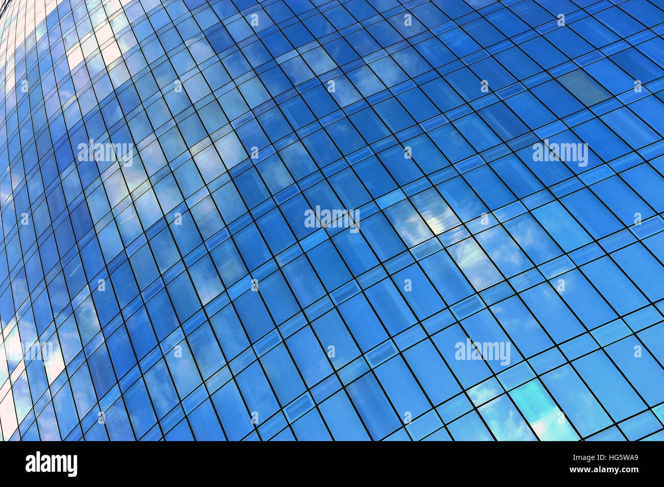 Blue sky with clouds in the office building glass Stock Photo - Alamy