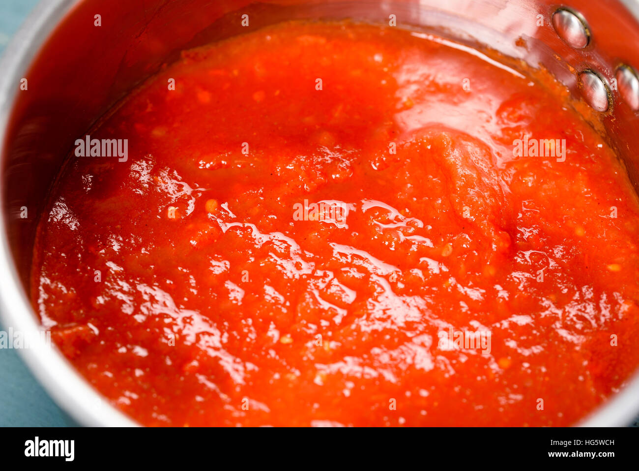 Preparing Tomato Sauce In Metal Pot Stock Photo Alamy