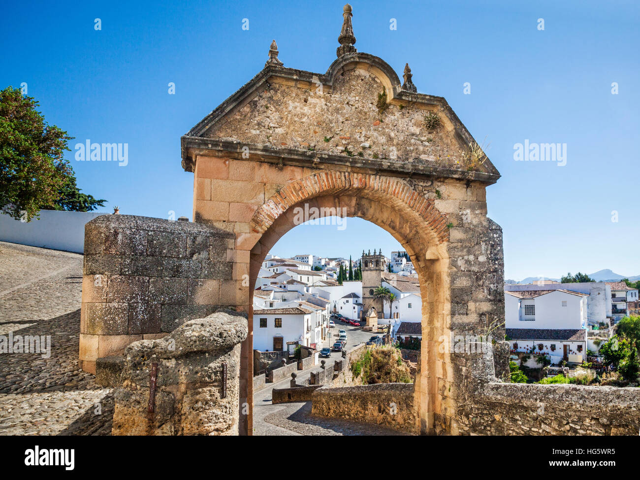 Spain, Andalusia, Province of Malaga, Ronda, Iglesia de Nuestro Padre Jesus and Puente Viejo (Old Bridge), across El Tajo Gorge Stock Photo
