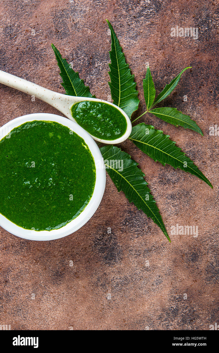 Medicinal Neem leaves with paste on stone background Stock Photo Alamy