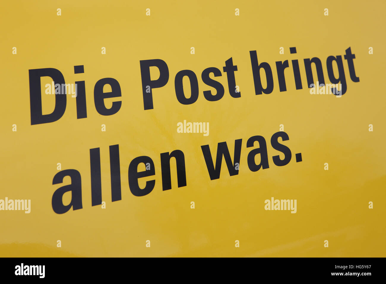German Post slogan: The Post brings everybody something. Stock Photo