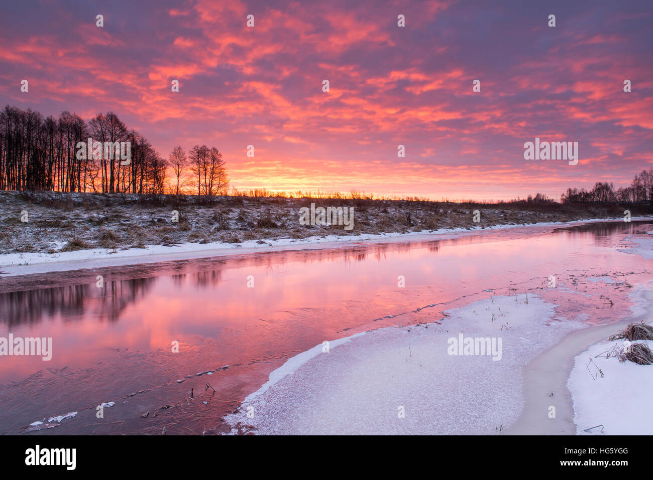Winter morning by the river at sunrise Stock Photo
