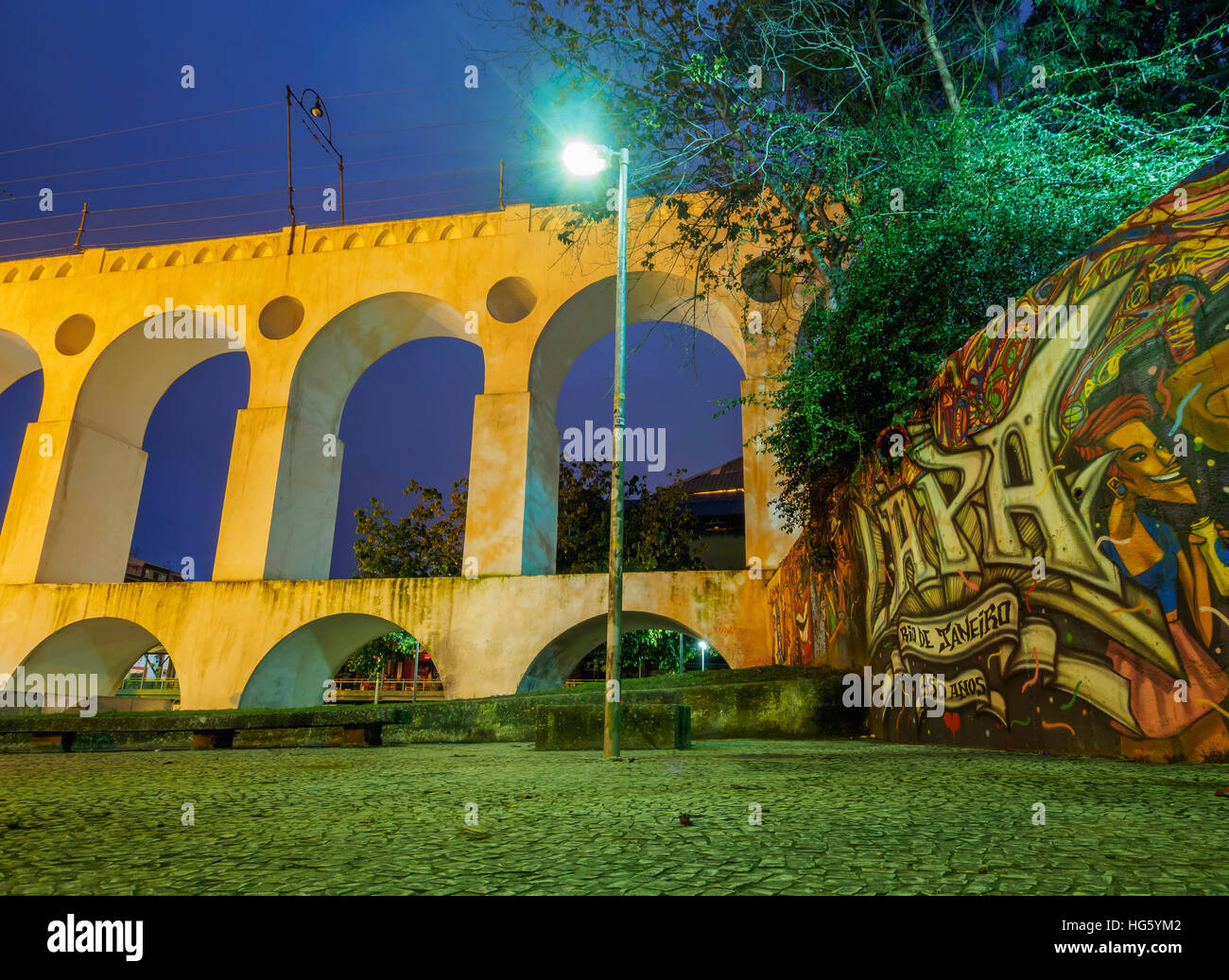 Brazil, City of Rio de Janeiro, Lapa, Twilight view of The Carioca Aqueduct. Stock Photo