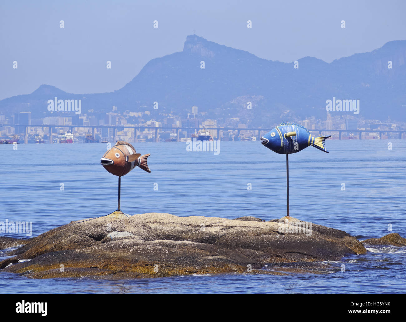 Brazil, State of Rio de Janeiro, Guanabara Bay, Paqueta Island, View of the coast of the island with two fished and Corcovado Stock Photo