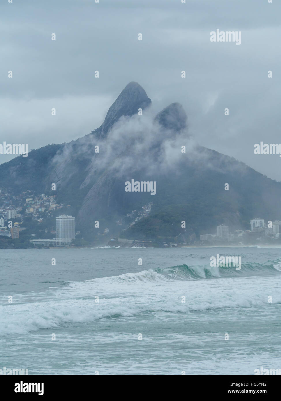 Brazil, City of Rio de Janeiro, Ipanema Beach and Morro Dois Irmaos on cloudy day. Stock Photo