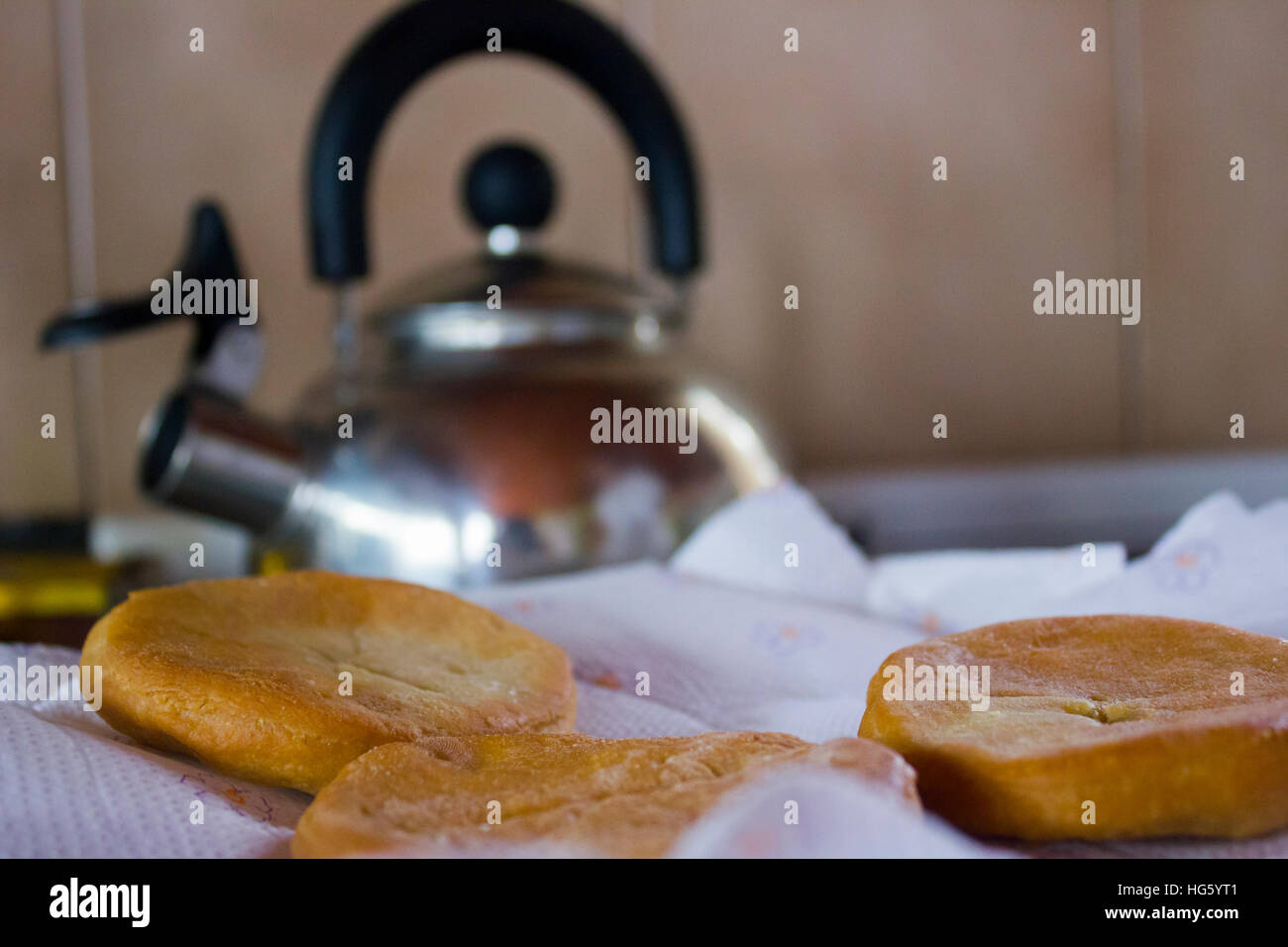 Fried cakes and kettle on background Stock Photo Alamy