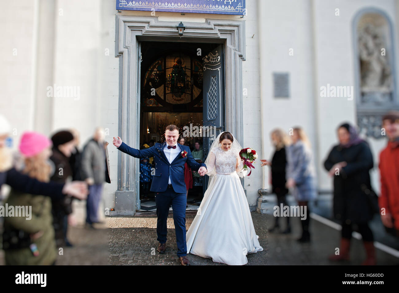 Guests showered newlyweds with colorful rice after wedding ceremony at