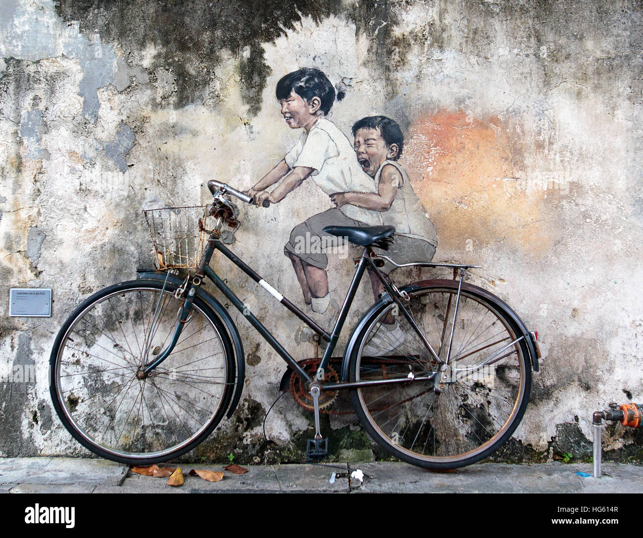 George Town, Penang, Malaysia - November 22: Street art mural by Lithuanian artist Ernest Zacharevic in Georgetown, Penang, Malaysia. Stock Photo
