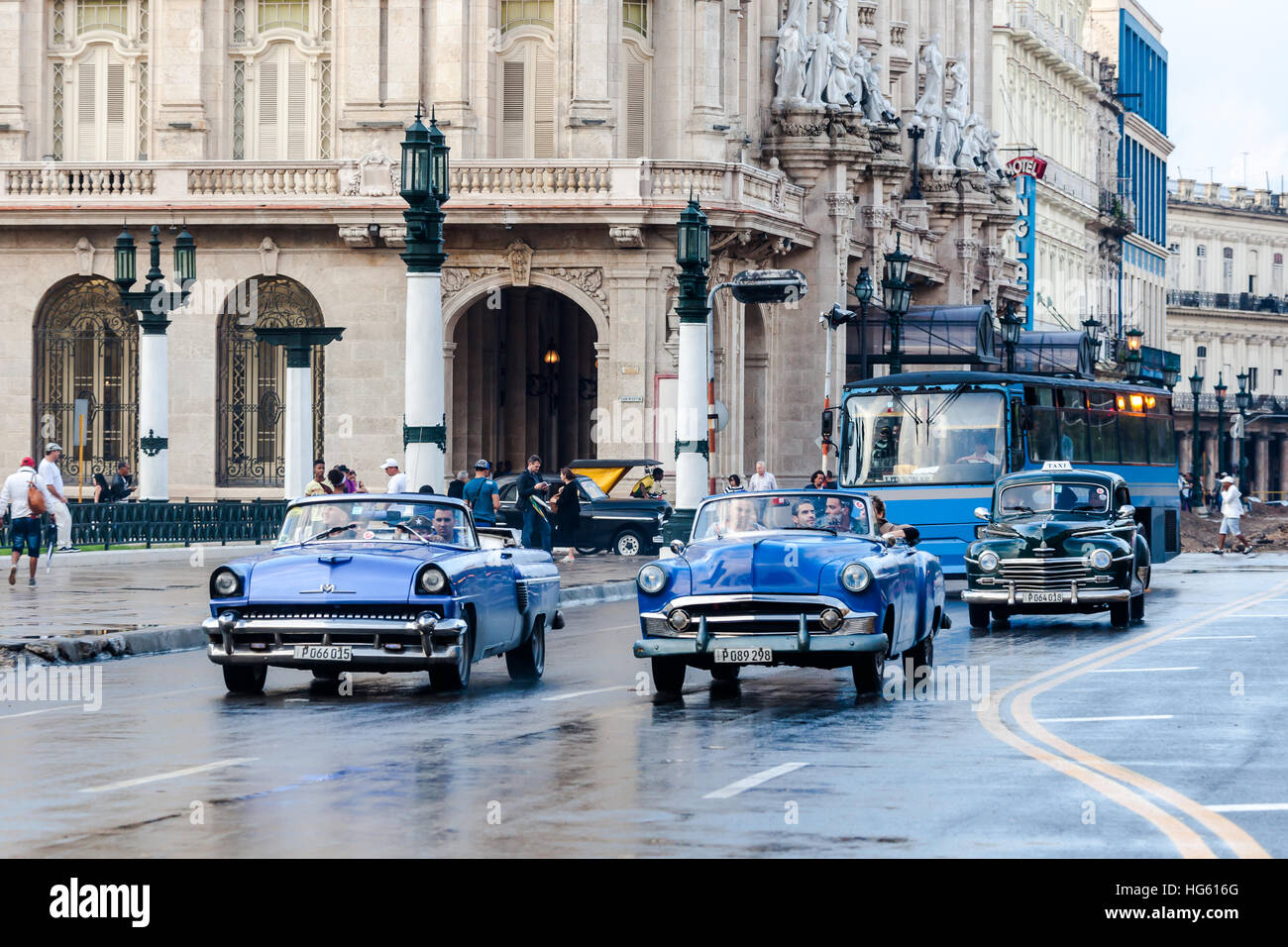 Havana, Cuba 2016.01.22 Retro classic American cars drive on the rainy roads round Parc Centrale in Havana, Cuba. Stock Photo