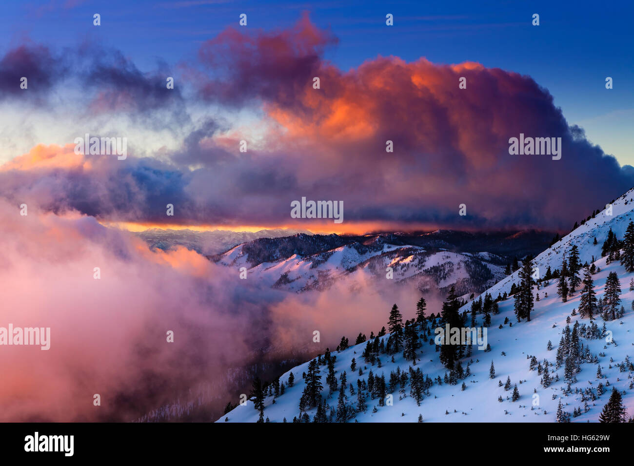 Sunrise in winter on Slide Mountain near Reno, NV on the Mt. Rose Highway. Colorful clouds and snowy landscape. Stock Photo