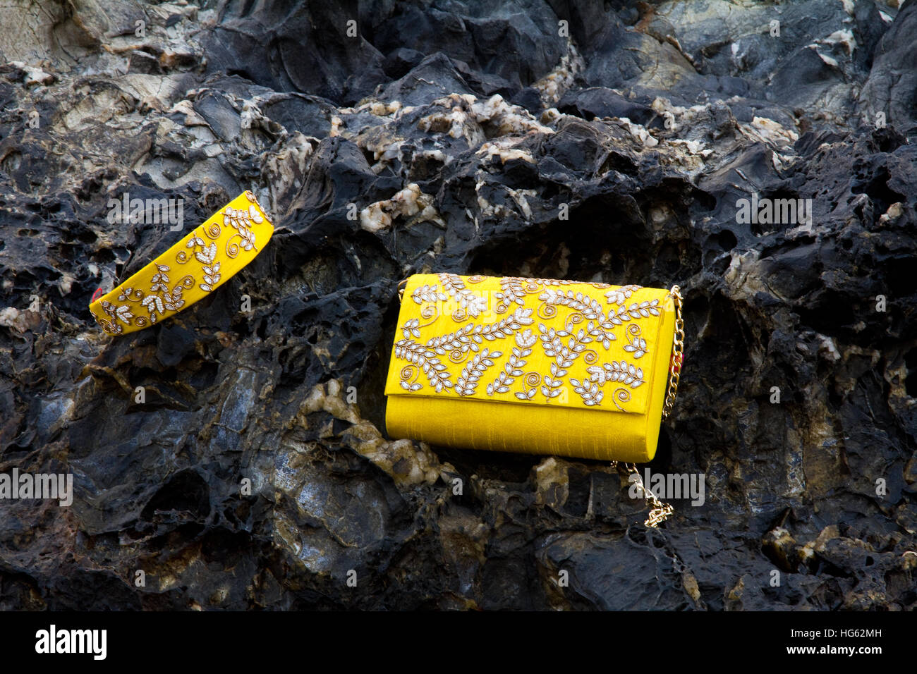 Yellow colored traditional ethnic Indian clutch (women's handbag) and a hair band with