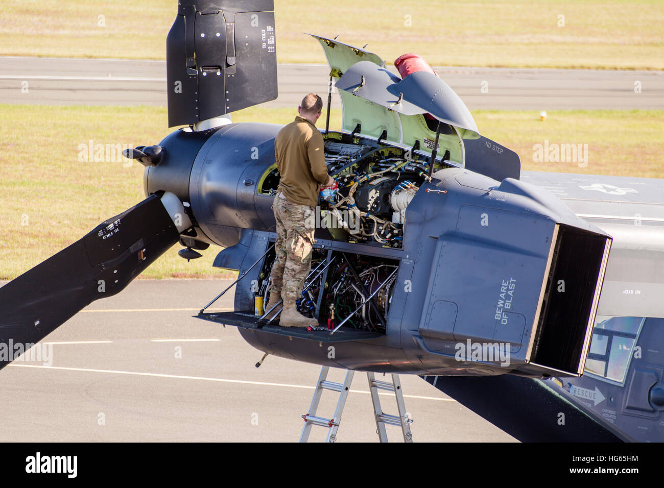 Technician working on a faulty engine of a CV-22 Osprey. Stock Photo