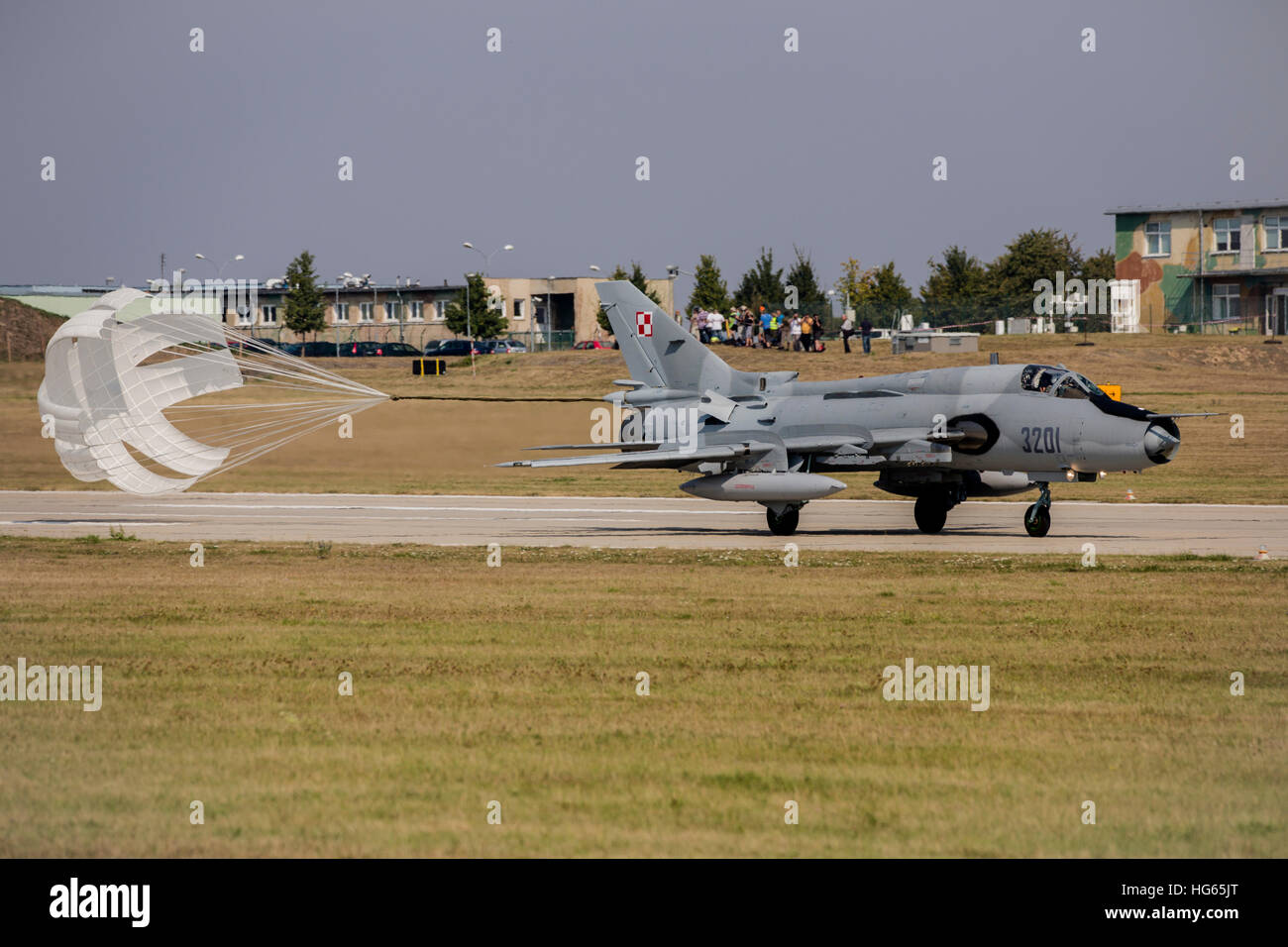 A Polish Air Force Su-22 fighter-bomber releases its drag chute upon landing. Stock Photo