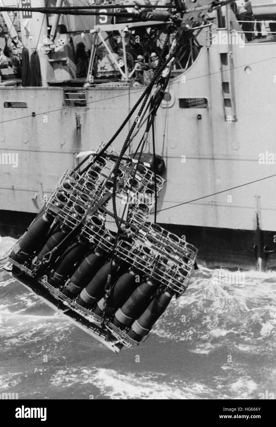 USS Rainier transfers ordnance to another ship while in the South China Sea, 1970. Stock Photo