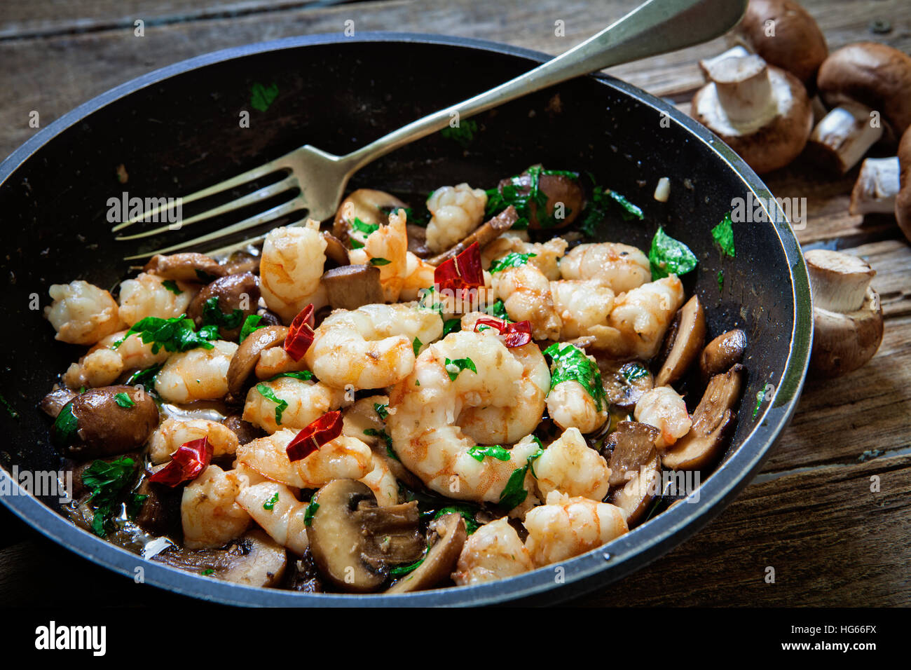 baby portobello mushroom roasted on pan with garlic Stock Photo - Alamy