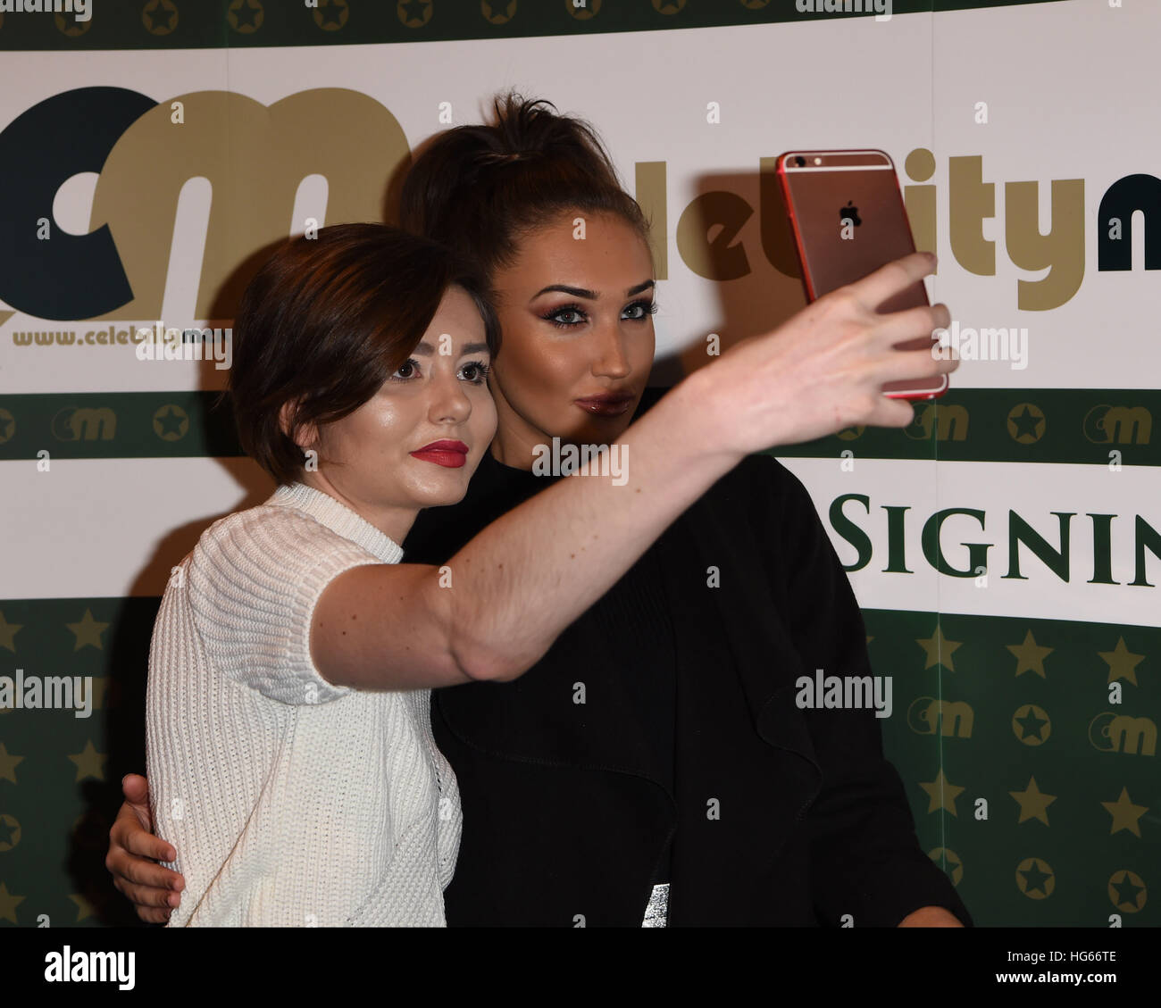 Megan McKenna and Charlotte Crosby signing copies of their calendars at The Clothes Show Live 2016 in Birmingham  Featuring: Megan McKenna Where: Birmingham, United Kingdom When: 05 Dec 2016 Stock Photo