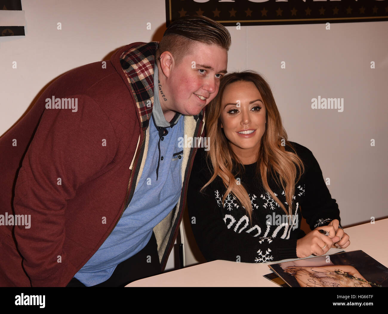 Megan McKenna and Charlotte Crosby signing copies of their calendars at The Clothes Show Live 2016 in Birmingham  Featuring: Charlotte Crosby Where: Birmingham, United Kingdom When: 05 Dec 2016 Stock Photo