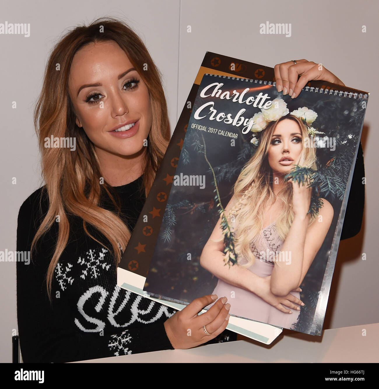 Megan McKenna and Charlotte Crosby signing copies of their calendars at The Clothes Show Live 2016 in Birmingham  Featuring: Charlotte Crosby Where: Birmingham, United Kingdom When: 05 Dec 2016 Stock Photo