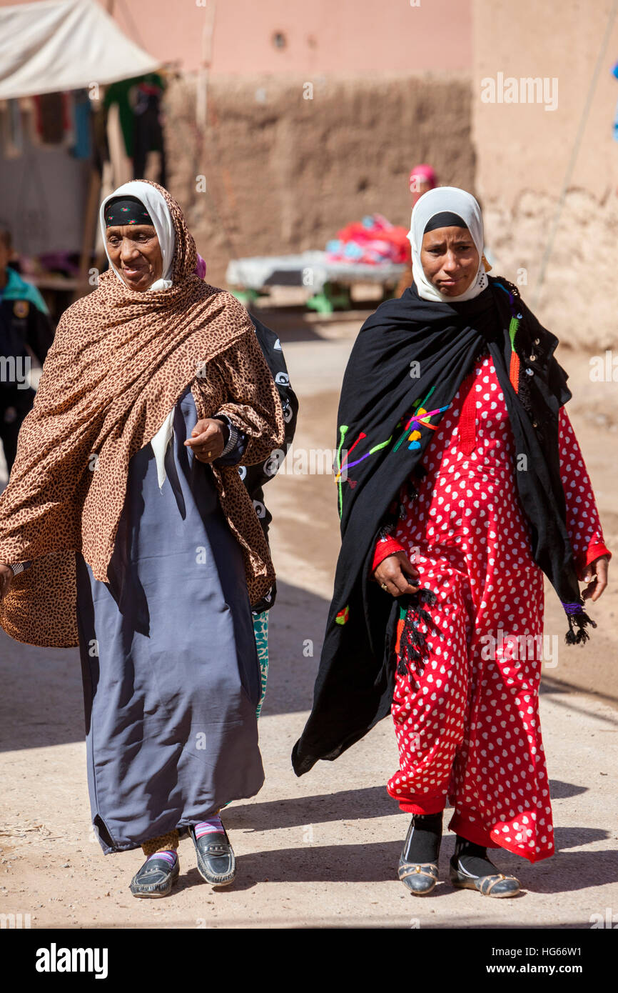 Elkhorbat, Morocco.  Amazigh Berber Women Walking in the Market. Stock Photo