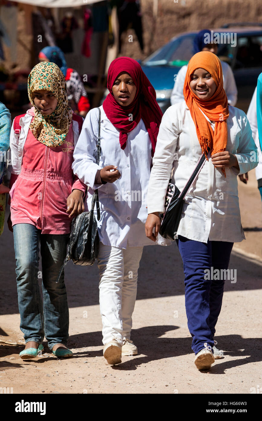 Elkhorbat, Morocco.  Young Afro-Berber Women Walking in the Market. Stock Photo