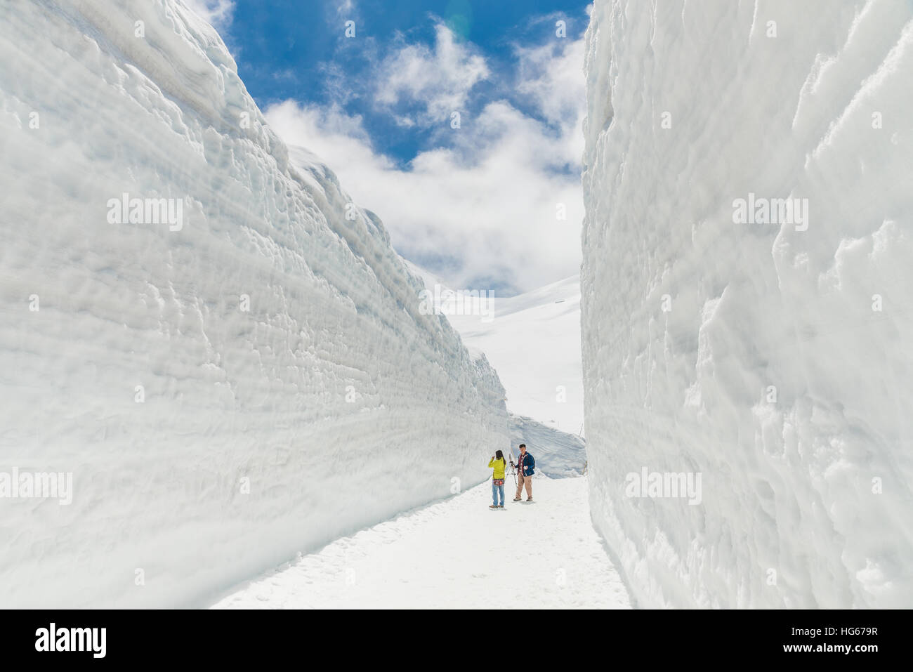 Tateyama, Japan - May 2, 2014: Unidentified tourists  visit at snow wall on Tateyama Kurobe Alpine Route,  Japanese Alps in Tateyama, Japan Stock Photo