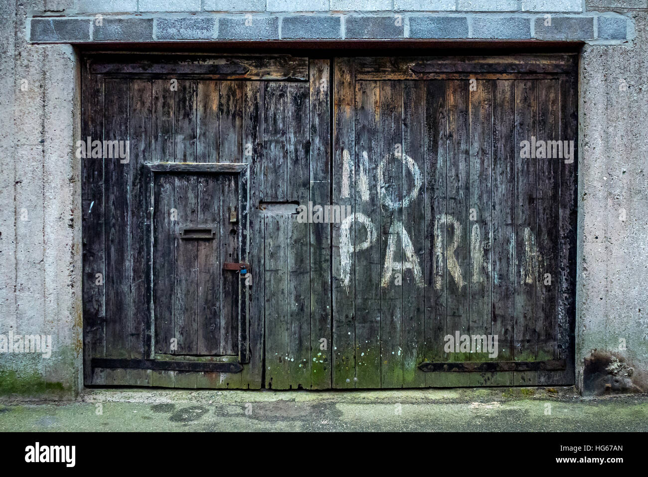 A Garage Door In Cornwall In A Poor State Of Repair Stock