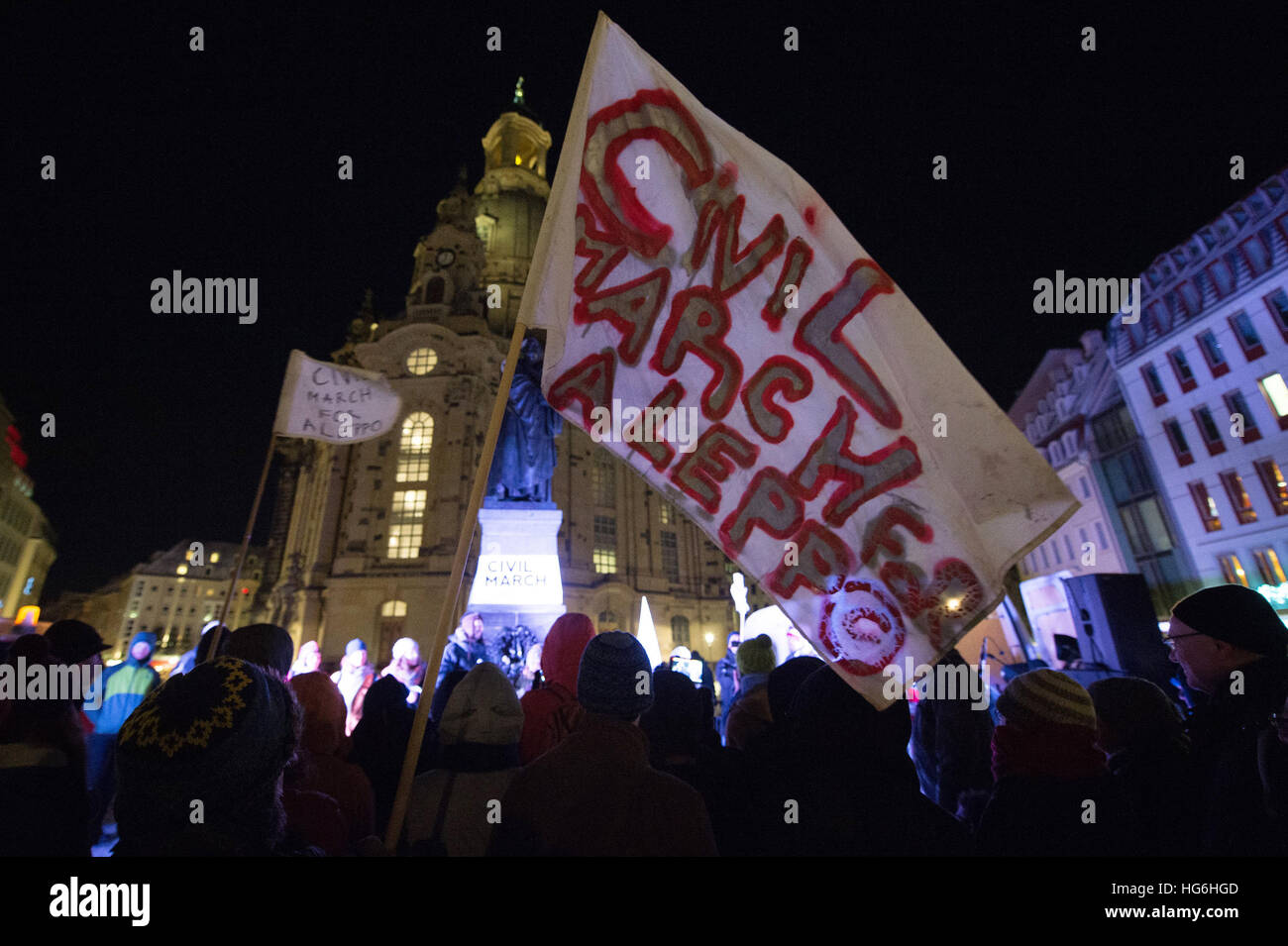 Dresden, Germany. 05th Jan, 2017. Members of a peace march stand on Neumarkt square outside the Frauenkirche church in Dresden, Germany, 05 January 2017. The peace march, which aims to generate solidarity for the civil population in Syria, began on 26 December 2016 in Berlin. Photo: Sebastian Kahnert/dpa-Zentralbild/dpa/Alamy Live News Stock Photo