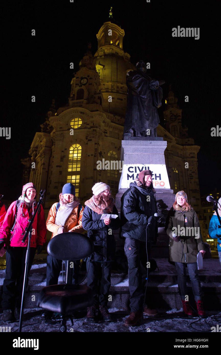 Dresden, Germany. 05th Jan, 2017. Members of a peace march stand on Neumarkt square outside the Frauenkirche church after their arrival in Dresden, Germany, 05 January 2017. The peace march, which aims to generate solidarity for the civil population in Syria, began on 26 December 2016 in Berlin. Photo: Sebastian Kahnert/dpa-Zentralbild/dpa/Alamy Live News Stock Photo