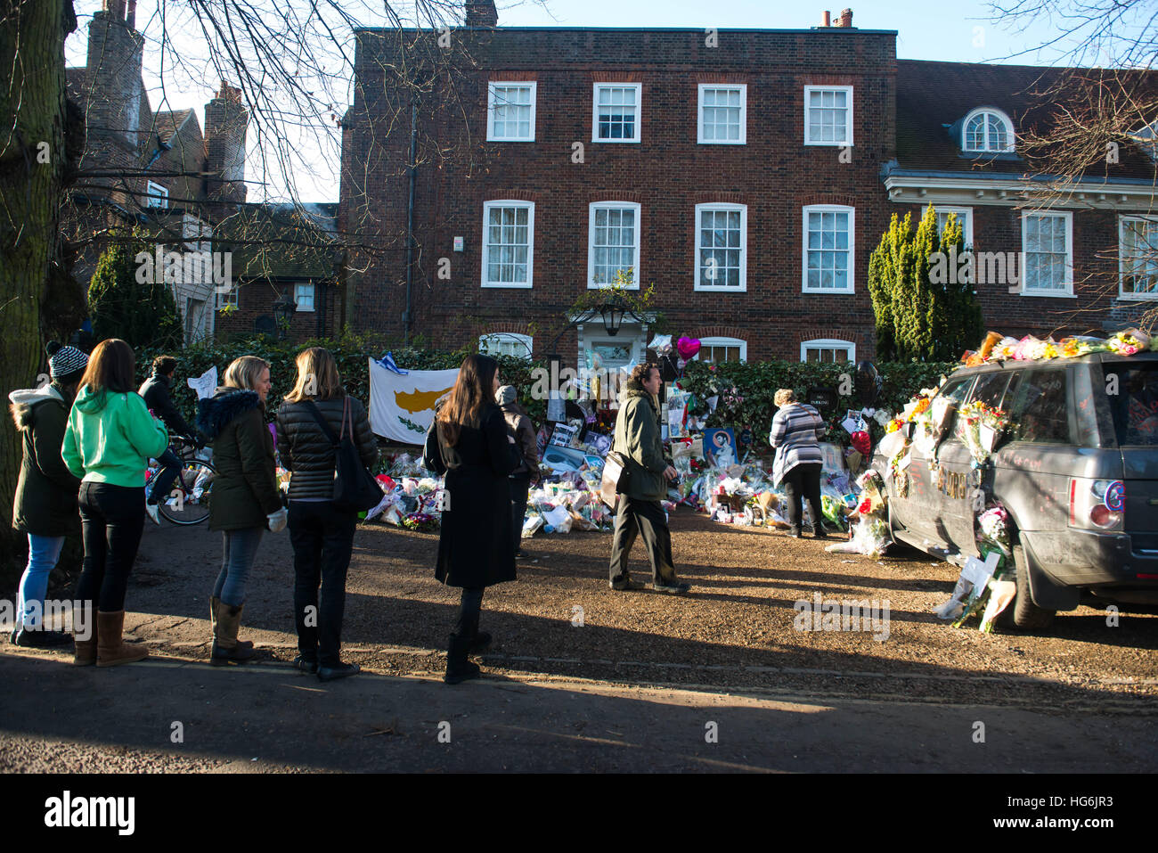 London, United Kingdom. 5th Jan, 2017. Tributes of flowers, photographs and candles are left outside the home of pop music icon George Michael in The Grove, Highgate in London, England. Singer George Michael died on Christmas day in his country home in Oxfordshire at the age of 53 on December 25. Credit: Michael Tubi/Alamy Live News Stock Photo