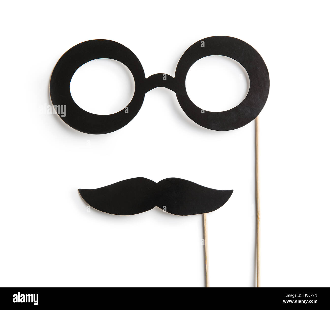 Fake glasses and mustaches on sticks. Isolated on white background. Stock Photo