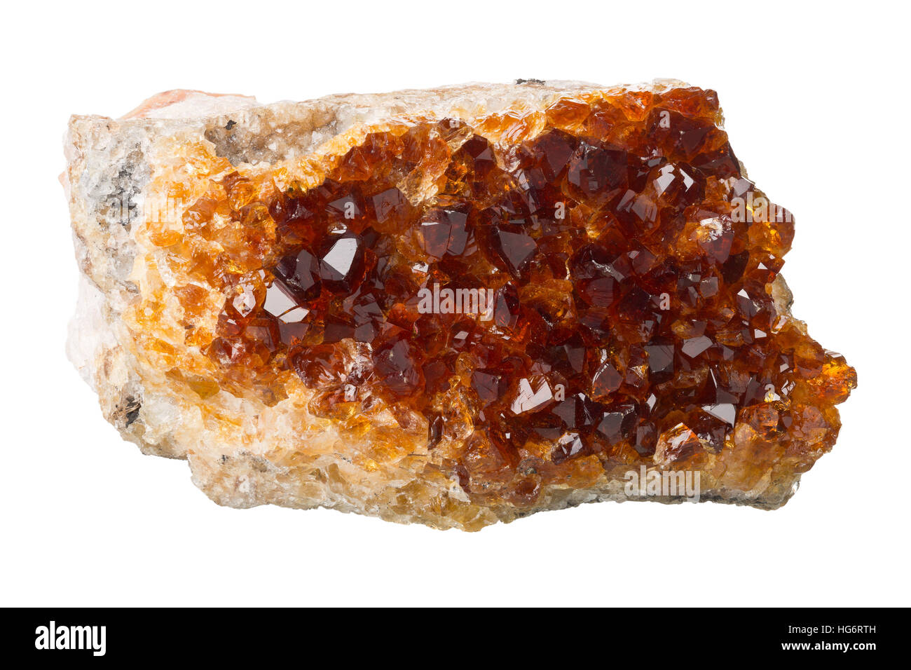 Burnt amethyst (citrine) crystal on matrix isolated on white background Stock Photo