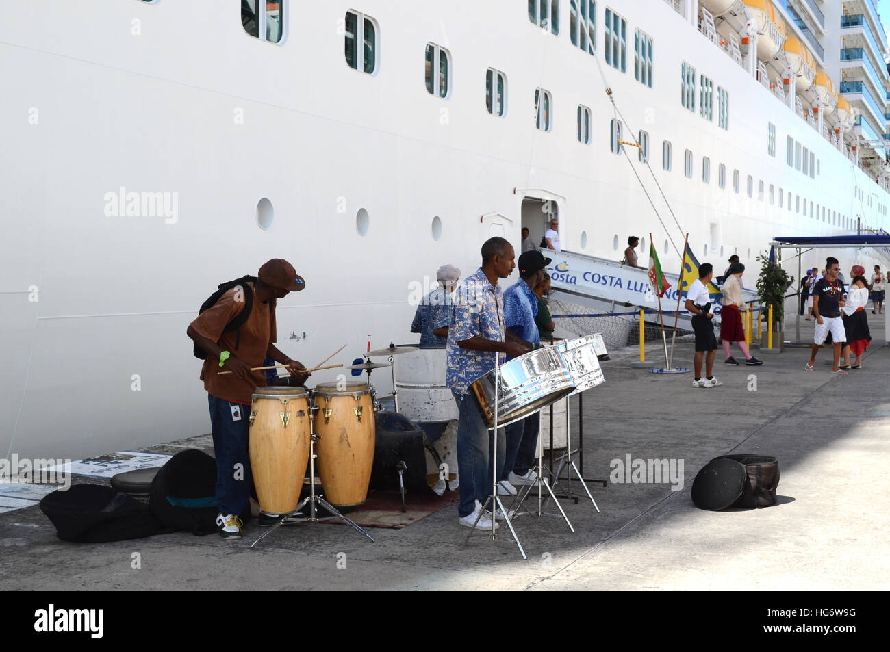 Local Calypso band plays for tourist as they disembark a cruise ship in St. Johns, Antigua. Stock Photo