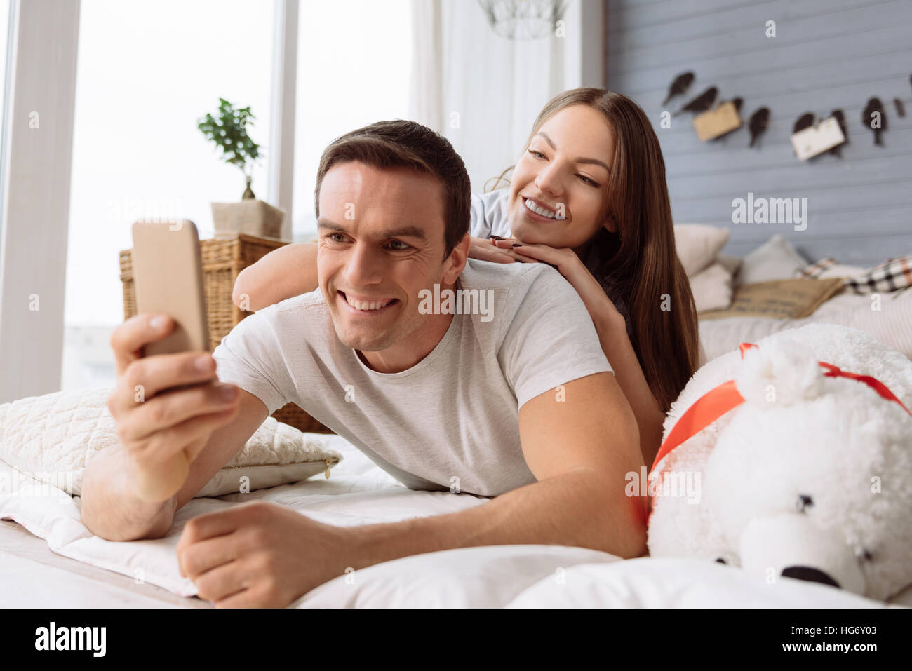 Cheerful handsome man taking a selfie Stock Photo