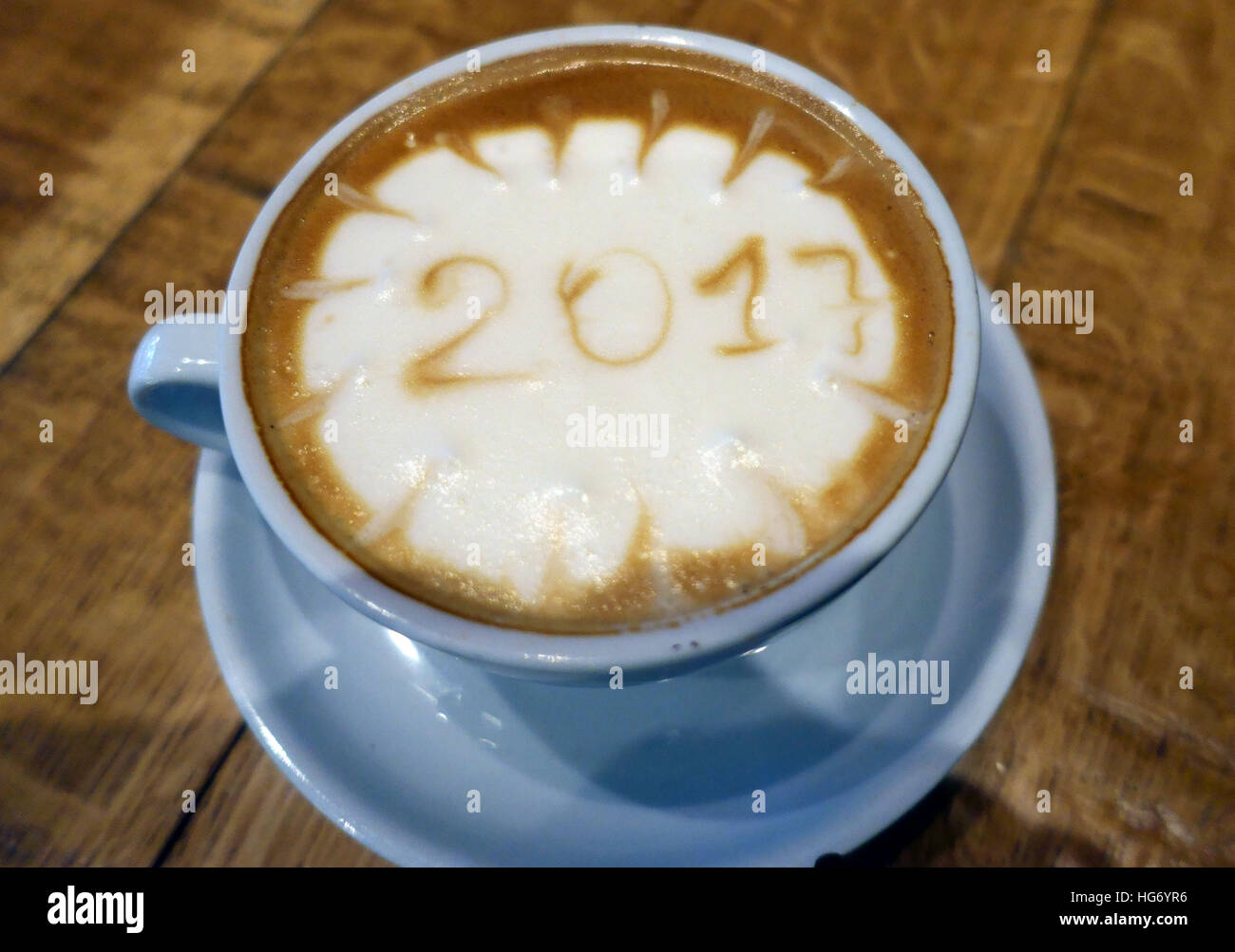 Year 2017 drawn in froth of cup of coffee, London Stock Photo