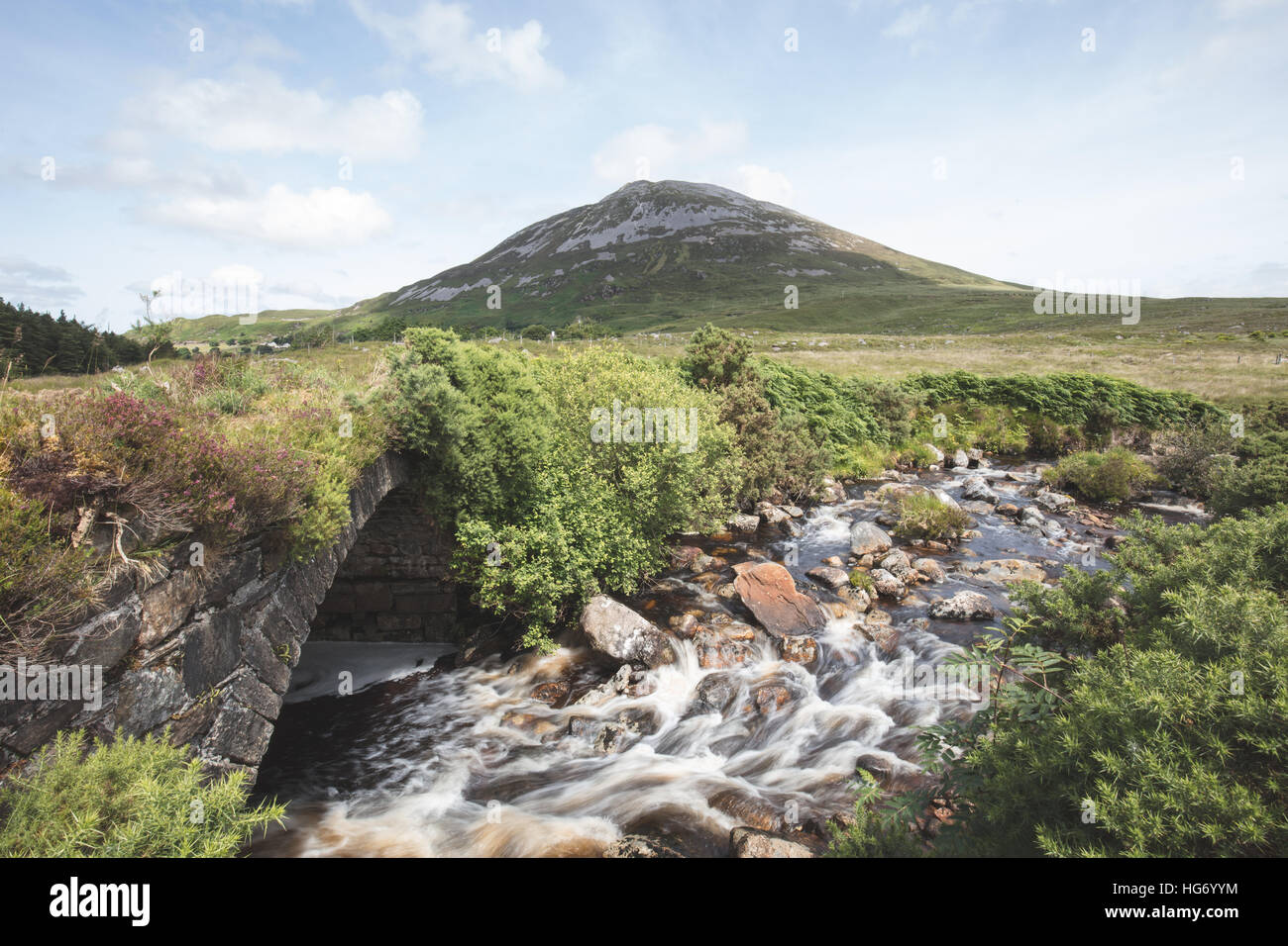 View of Mount Errigal from an old bridge in the poisoned Glen. Glenveagh national park, County Donegal, Ireland. Stock Photo