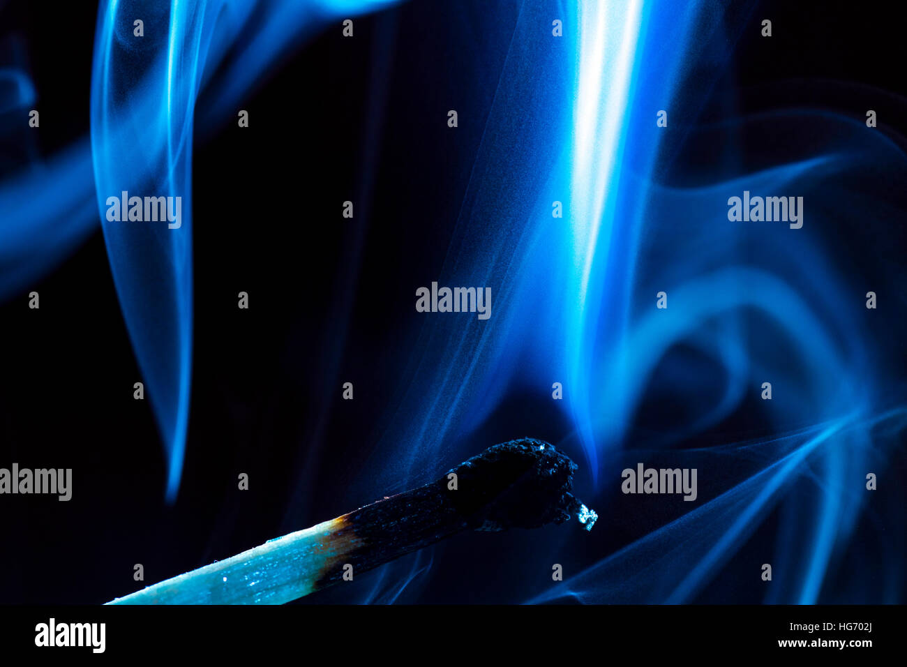 Burning match on a black background Stock Photo - Alamy