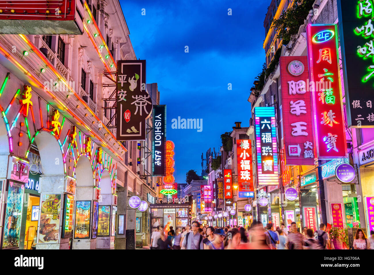 GUANGZHOU, CHINA - MAY 25, 2014: Pedestrians pass through Shangxiajiu Pedestrian Street. The street is the main shopping district of the city and a ma Stock Photo
