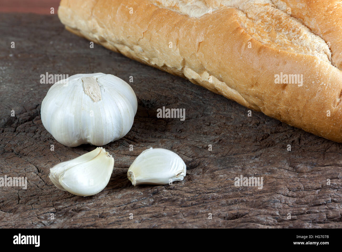 Garlic cloves on a vintage wooden background Stock Photo - Alamy