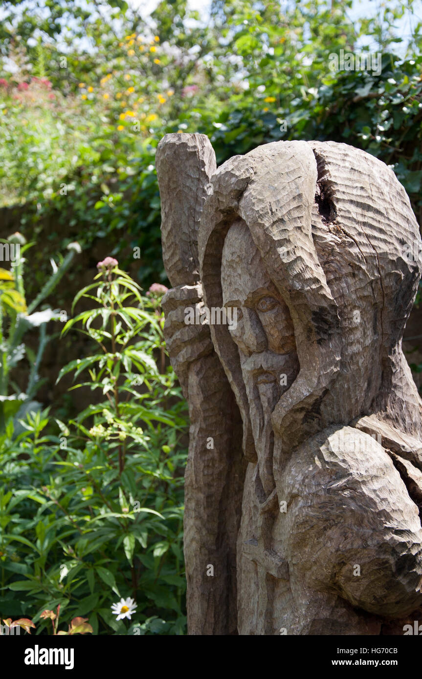 Wooden wizard sculpture in garden Stock Photo Alamy