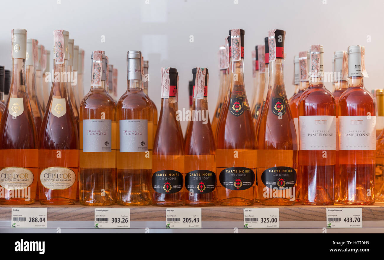 Rose wine from different manufacturers closeup presented on the store shelfs at Kyiv Wine Festival organized by Good Wine. Stock Photo