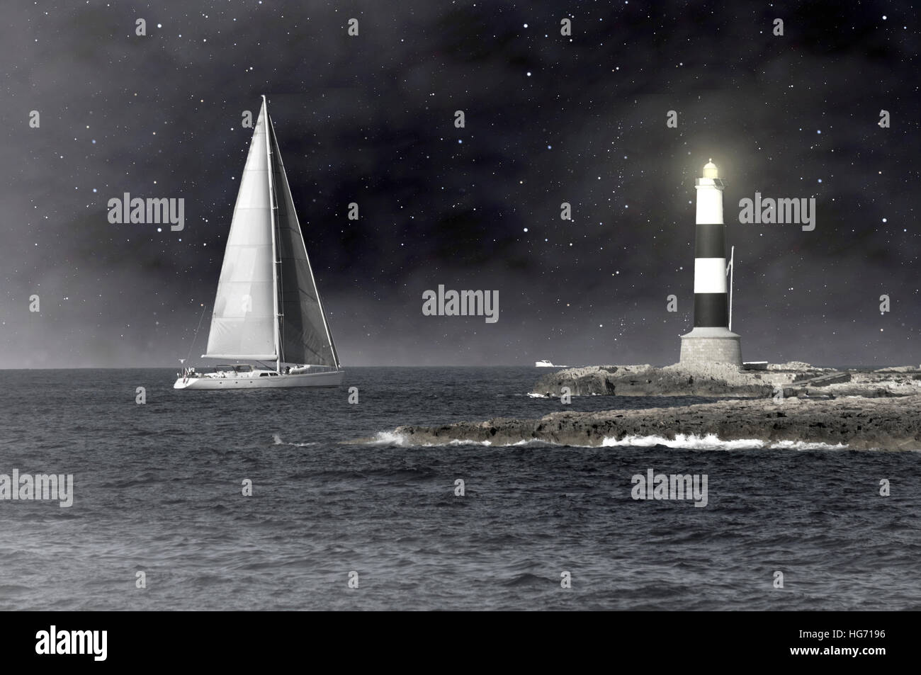 A lighthouse guides the sailboat in the night Stock Photo
