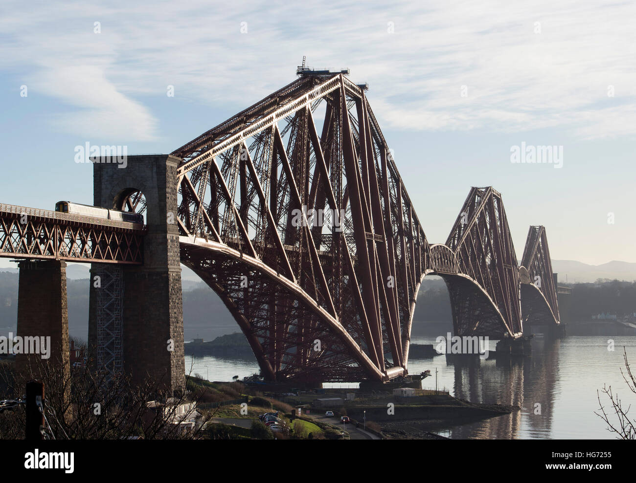 The Forth Rail Bridge viewed from the village of North Queensferry looking south over the Firth of Forth. Stock Photo