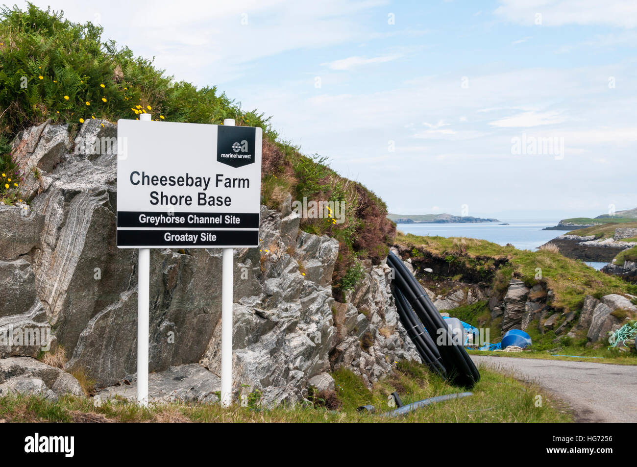 Sign at the Cheesebay Farm Shore Base owned and operated by Marine Harvest, on the Hebridean island of North Uist. Stock Photo